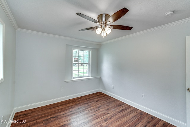 empty room featuring ceiling fan, dark hardwood / wood-style floors, and ornamental molding