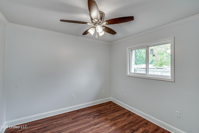 empty room with ceiling fan, dark hardwood / wood-style flooring, and crown molding