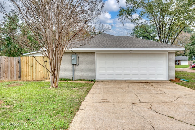 garage featuring a lawn