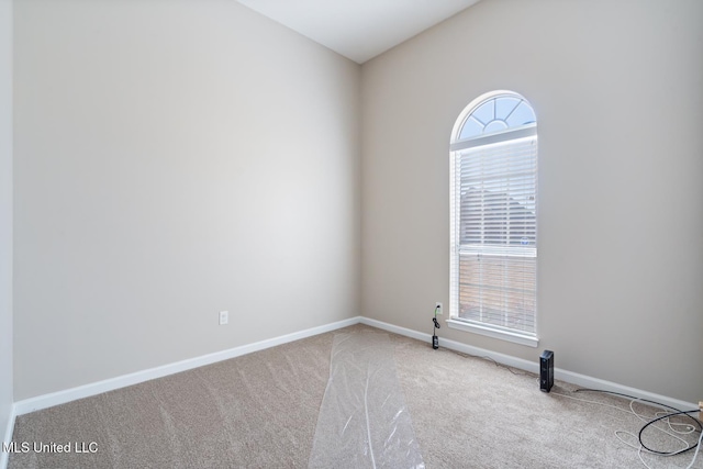 carpeted empty room with plenty of natural light