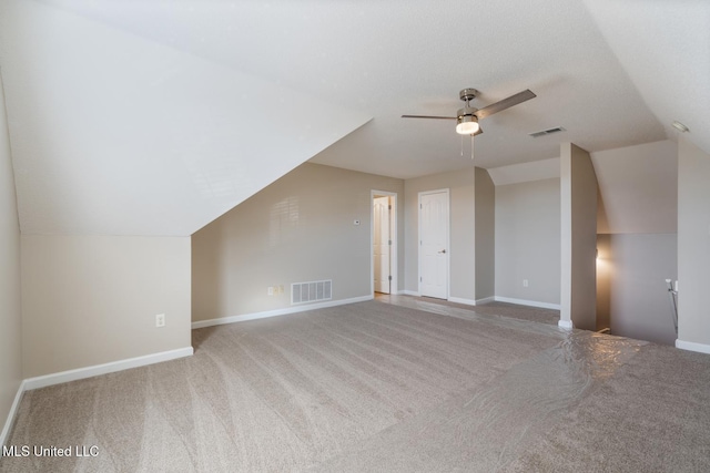 bonus room featuring ceiling fan, carpet flooring, and lofted ceiling