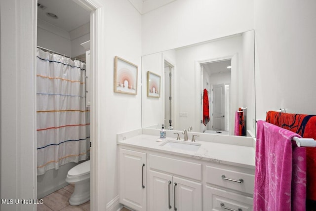 full bathroom with vanity, toilet, shower / bath combo with shower curtain, and tile patterned flooring