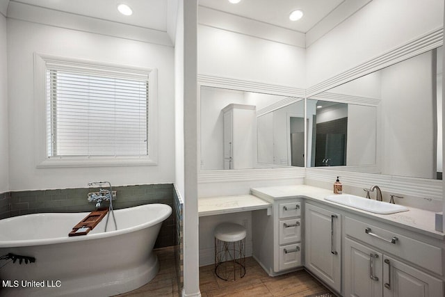 bathroom featuring vanity and a bathing tub