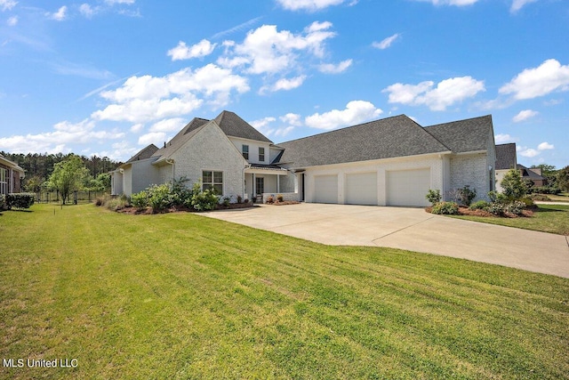 view of front of property with a front lawn and a garage