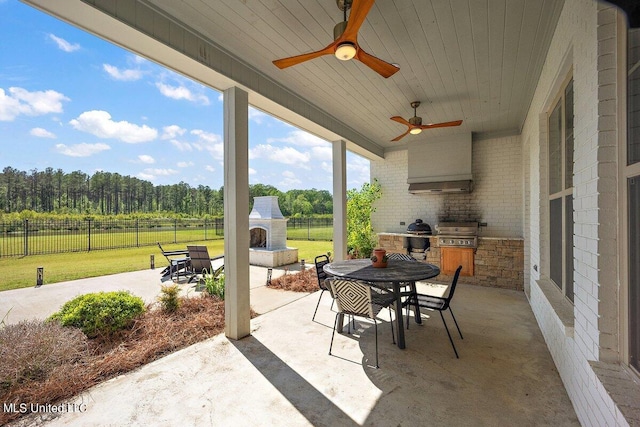 view of patio with grilling area and ceiling fan