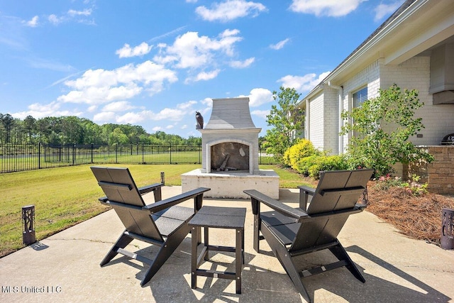 view of patio / terrace featuring exterior fireplace