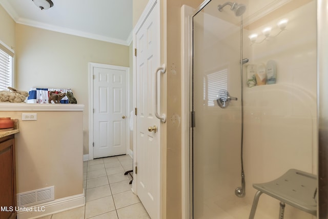 2325 Rue Beaux Chenes, Ocean Springs, MS 39564 - bathroom featuring ornamental molding, a shower stall, tile patterned flooring, vanity, and baseboards