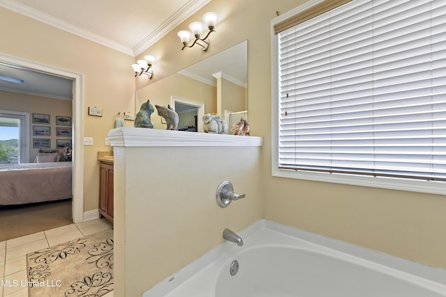 2325 Rue Beaux Chenes, Ocean Springs, MS 39564 - bathroom featuring a bathtub, connected bathroom, tile patterned flooring, ornamental molding, and vanity