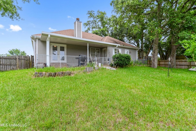 2325 Rue Beaux Chenes, Ocean Springs, MS 39564 - back of house featuring a chimney and roof with shingles