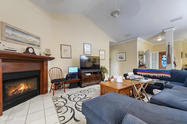 2325 Rue Beaux Chenes, Ocean Springs, MS 39564 - living room with light tile patterned flooring, a glass covered fireplace, high vaulted ceiling, and ornamental molding