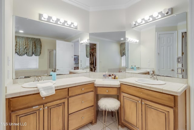 bathroom with tile patterned flooring, vanity, crown molding, and a shower with door