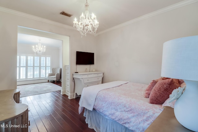 bedroom featuring dark wood-type flooring, crown molding, and a notable chandelier