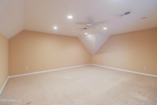 carpeted empty room with lofted ceiling and ceiling fan