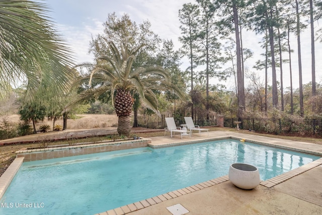 view of pool featuring a patio area