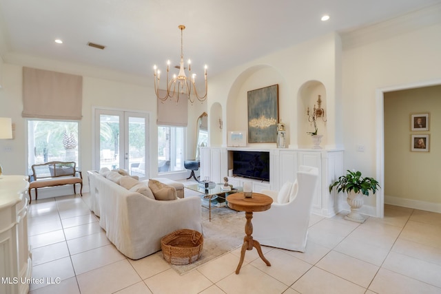 living room featuring french doors, light tile patterned flooring, and a notable chandelier