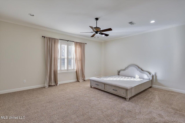 carpeted bedroom featuring ceiling fan and crown molding