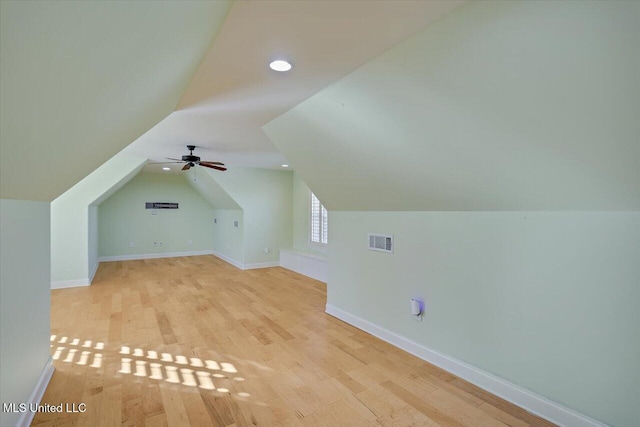 additional living space with ceiling fan, light hardwood / wood-style flooring, and lofted ceiling