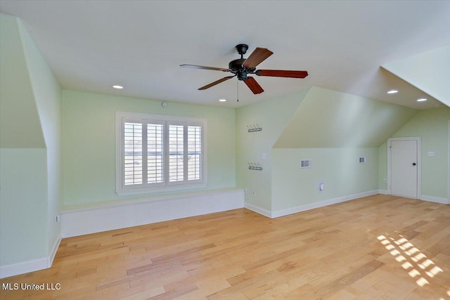 additional living space with lofted ceiling, ceiling fan, and light hardwood / wood-style flooring