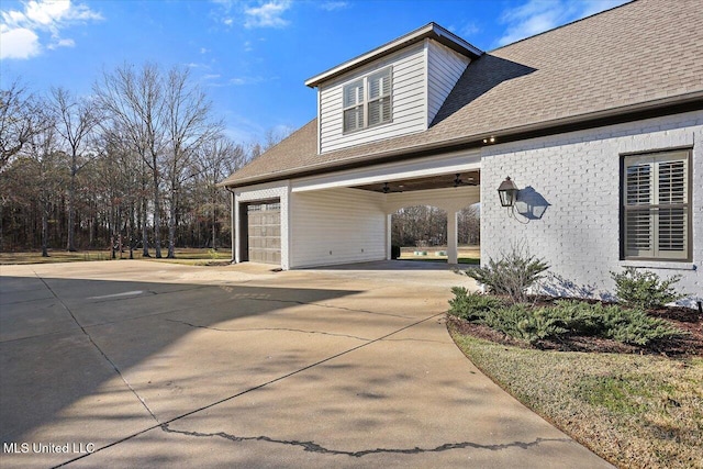 view of home's exterior with a carport