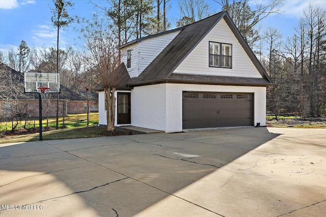 view of side of home featuring a garage