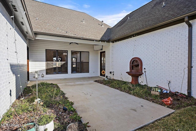 entrance to property featuring a patio