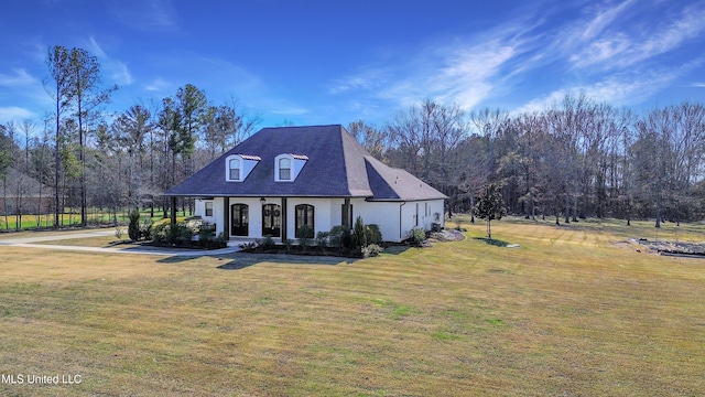 view of front of property with a front yard and covered porch