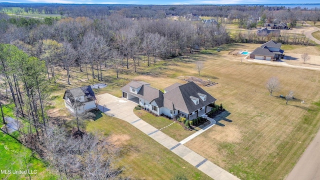 birds eye view of property with a rural view