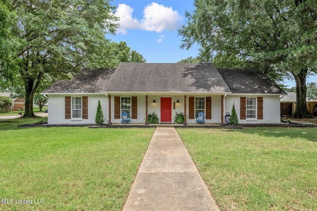 7101 Blue Grass Rd, Olive Branch, MS 38654 - view of front of property with brick siding, covered porch, and a front lawn