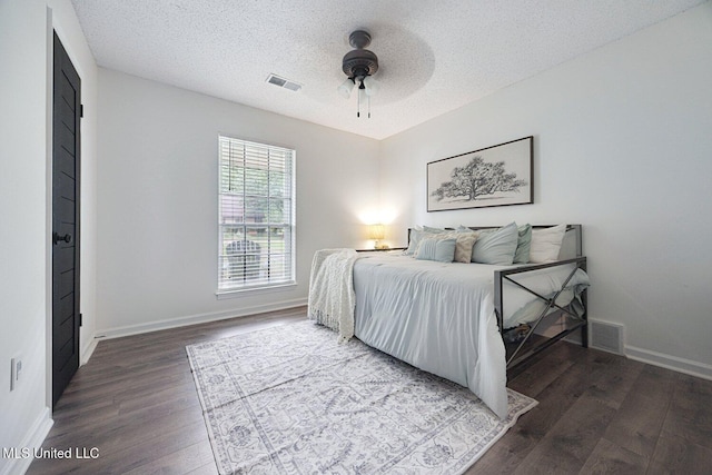 7101 Blue Grass Rd, Olive Branch, MS 38654 - bedroom featuring wood finished floors, a textured ceiling, and a ceiling fan