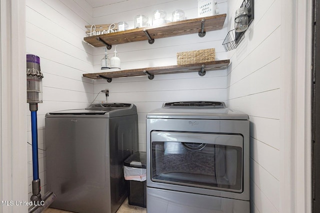 7101 Blue Grass Rd, Olive Branch, MS 38654 - washroom featuring washer and dryer and wooden walls
