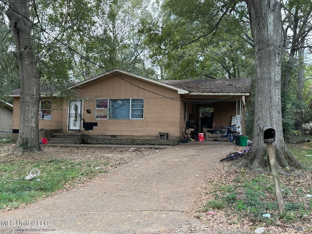 view of front of property with a carport