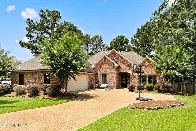 103 Maple Grv, Madison, MS 39110 - view of front of house with an attached garage, brick siding, a shingled roof, and driveway