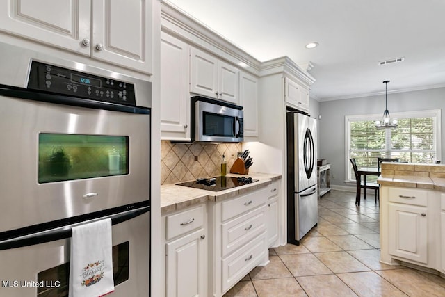 103 Maple Grv, Madison, MS 39110 - kitchen with stainless steel appliances, tasteful backsplash, crown molding, white cabinetry, and recessed lighting