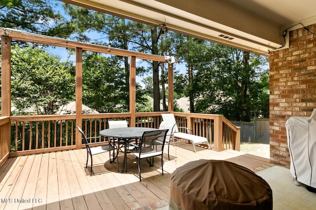 103 Maple Grv, Madison, MS 39110 - wooden deck with outdoor dining area, a grill, and view of scattered trees