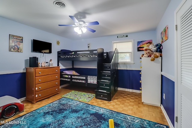 bedroom featuring parquet floors and ceiling fan