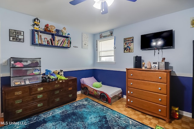 bedroom with parquet floors and ceiling fan