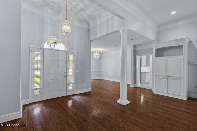 706 Danforth Dr, Madison, MS 39110 - foyer entrance featuring ornate columns, a chandelier, wood finished floors, baseboards, and ornamental molding
