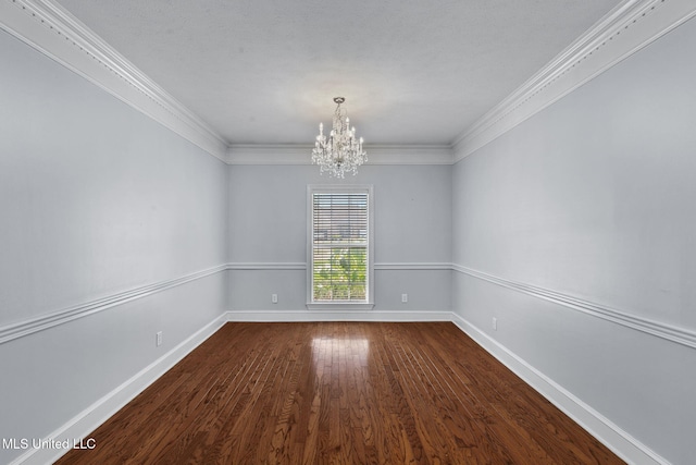 706 Danforth Dr, Madison, MS 39110 - spare room featuring a chandelier, dark wood-type flooring, crown molding, and baseboards