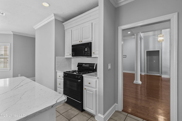 706 Danforth Dr, Madison, MS 39110 - kitchen featuring black appliances, ornamental molding, white cabinetry, light tile patterned floors, and light stone counters