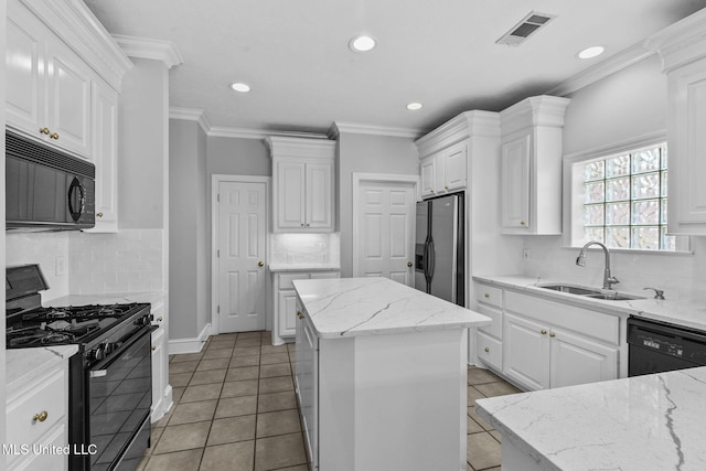 706 Danforth Dr, Madison, MS 39110 - kitchen featuring black appliances, a sink, white cabinets, recessed lighting, and ornamental molding