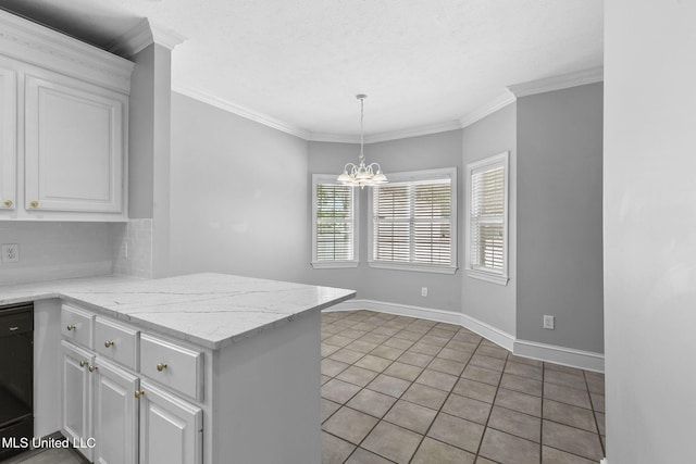 706 Danforth Dr, Madison, MS 39110 - kitchen with white cabinetry, a chandelier, a peninsula, hanging light fixtures, and light tile patterned floors