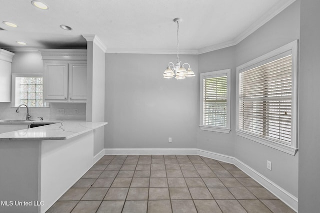 706 Danforth Dr, Madison, MS 39110 - unfurnished dining area with a sink, ornamental molding, baseboards, a chandelier, and recessed lighting