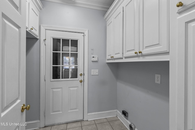 706 Danforth Dr, Madison, MS 39110 - laundry area with cabinet space, light tile patterned flooring, baseboards, and ornamental molding