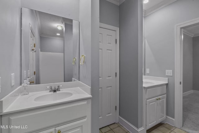 706 Danforth Dr, Madison, MS 39110 - bathroom with crown molding, two vanities, tile patterned flooring, and baseboards
