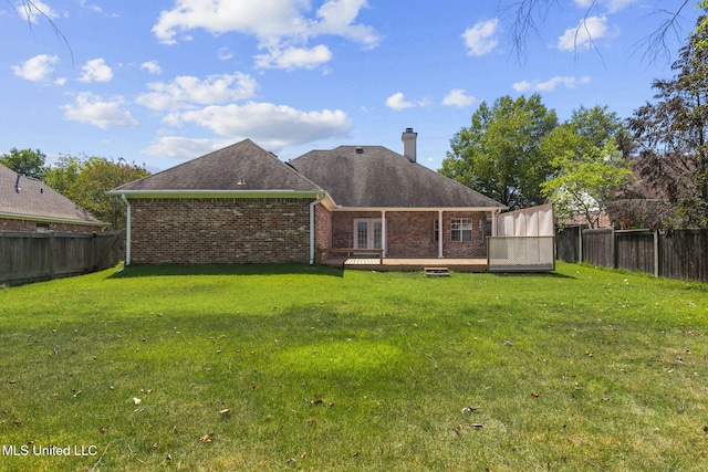 706 Danforth Dr, Madison, MS 39110 - back of property with brick siding, a chimney, a wooden deck, and a shingled roof
