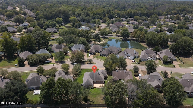 706 Danforth Dr, Madison, MS 39110 - aerial view of property's location with nearby suburban area, a large body of water, and a heavily wooded area