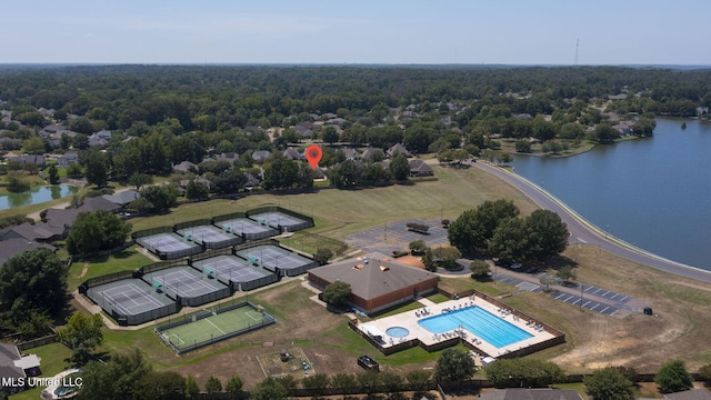 706 Danforth Dr, Madison, MS 39110 - aerial view of a pool area, a nearby body of water, and a heavily wooded area