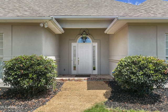 706 Danforth Dr, Madison, MS 39110 - property entrance featuring a shingled roof and stucco siding