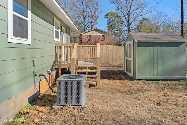 view of yard with a shed and central air condition unit