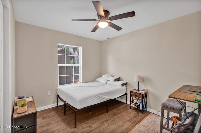 101 30th St, Gulfport, MS 39507 - bedroom featuring wood finished floors, baseboards, and a ceiling fan